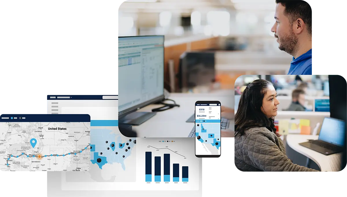 Two people working at desks with computer screens showing maps, charts, and graphs. A mobile phone also displays analytics, suggesting a data-driven or logistics work environment.