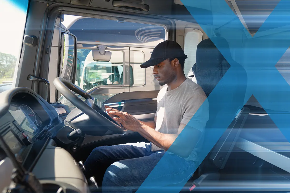 A man wearing a black cap sits in a truck cab, using load matching software on a touchscreen device mounted on the dashboard. Blue diagonal streaks overlay the image.