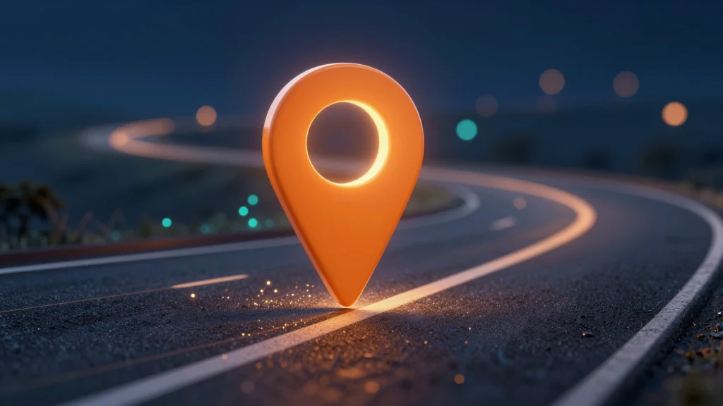 A glowing orange location pin stands on a curved, empty road at night with blurred lights in the background, symbolizing navigation or a destination.